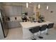 Modern kitchen with gray cabinets, white countertops and stainless steel appliances at 2393 Jernigan Loop, Kissimmee, FL 34746