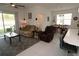 Spacious living room with tiled floors and access to the backyard at 2393 Jernigan Loop, Kissimmee, FL 34746
