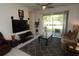 Relaxing living room with patio access, large TV, and comfortable seating at 2393 Jernigan Loop, Kissimmee, FL 34746