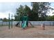 Community playground with playset, slide, and spring rider at 2393 Jernigan Loop, Kissimmee, FL 34746
