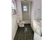 Bathroom with a toilet, shower, and white vanity at 2680 Palmetto Rd, Mount Dora, FL 32757