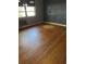 Spacious bedroom with hardwood floors and ample natural light at 2680 Palmetto Rd, Mount Dora, FL 32757