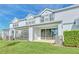Home's backyard with screened patio and grass at 3780 Plainview Dr, Orlando, FL 32824