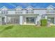 Home's backyard showcasing a screened patio and lawn at 3780 Plainview Dr, Orlando, FL 32824