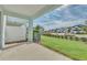 Covered patio with view of grassy lawn and neighborhood at 3780 Plainview Dr, Orlando, FL 32824