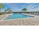 Inviting community pool with lounge chairs and lush landscaping at 3780 Plainview Dr, Orlando, FL 32824