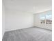 Spacious bedroom with large window and plush, neutral carpeting at 4144 Lavender Ct, Lake Hamilton, FL 33851