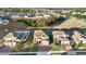 Aerial view of a two-story house and surrounding neighborhood at 488 Sapphire Dr, Davenport, FL 33837
