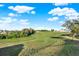 Large backyard with grassy area and mature trees at 488 Sapphire Dr, Davenport, FL 33837