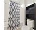 Clean bathroom with shower/tub combo and patterned shower curtain at 488 Sapphire Dr, Davenport, FL 33837