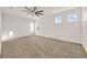 Spacious bedroom with ceiling fan and multiple windows at 488 Sapphire Dr, Davenport, FL 33837