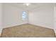 Well-lit bedroom with neutral wall and carpet, and a window at 488 Sapphire Dr, Davenport, FL 33837