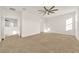 Bright bedroom featuring a ceiling fan and neutral carpeting at 488 Sapphire Dr, Davenport, FL 33837