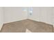 Spacious bedroom with neutral carpeting and ample natural light at 488 Sapphire Dr, Davenport, FL 33837