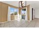 Dining room with sliding glass door, windows, and tile flooring at 488 Sapphire Dr, Davenport, FL 33837