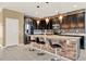 Modern kitchen with dark cabinets, granite counters and island at 488 Sapphire Dr, Davenport, FL 33837