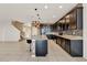 Spacious kitchen with dark cabinets, granite countertops, and an island with bar seating at 488 Sapphire Dr, Davenport, FL 33837