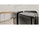 Laundry room with washer, dryer, and cabinets at 488 Sapphire Dr, Davenport, FL 33837