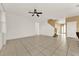 Spacious living room featuring tile floors and a ceiling fan at 488 Sapphire Dr, Davenport, FL 33837