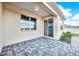 Covered patio with paver stones and sliding glass door access at 488 Sapphire Dr, Davenport, FL 33837