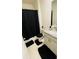 Bathroom with granite vanity, black shower curtain, and tile flooring at 811 Turner Ln, Winter Haven, FL 33881