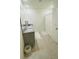 Modern bathroom with double sinks, granite countertop, and a shower at 811 Turner Ln, Winter Haven, FL 33881