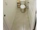 Small bathroom with toilet and beige tile floor at 811 Turner Ln, Winter Haven, FL 33881