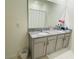 Bathroom featuring double sinks, granite countertops, and a shower at 811 Turner Ln, Winter Haven, FL 33881