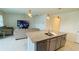 Kitchen with island, granite countertops, stainless steel dishwasher, and living room view at 811 Turner Ln, Winter Haven, FL 33881