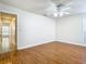 Bright bedroom featuring wood floors and access to hallway at 940 Douglas Ave # 217, Altamonte Springs, FL 32714