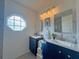 Updated bathroom with double vanities and modern fixtures at 3258 Cranston St, Deltona, FL 32738