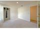 Bedroom with carpeted floors, a closet, and access to a bathroom at 3258 Cranston St, Deltona, FL 32738