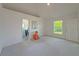 Spacious bedroom with plush carpet, a large window, and ensuite bathroom access at 3258 Cranston St, Deltona, FL 32738