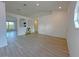 Spacious living area with neutral paint and modern wood-look flooring at 3258 Cranston St, Deltona, FL 32738