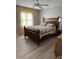 Bedroom with wooden bed frame and light gray flooring at 11 Sandra Cir, New Smyrna Beach, FL 32168