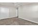 Simple bedroom with a closet and carpet flooring at 1128 Sugarwood St, Davenport, FL 33837