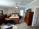 Spacious bedroom with wood furniture and carpeted floor at 18802 Merrich Rd, Orlando, FL 32820