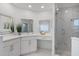 Elegant Primary bathroom featuring a double vanity, glass shower, and marble tile at 2110 Turkey Oak Ct, Oviedo, FL 32766