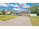 Charming single-story home with a fenced yard and attached two-car garage at 3081 Cloverdale St, Deltona, FL 32738