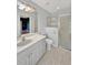 Bathroom with shower, toilet, and vanity with a white countertop at 310 Stonington Way, Deland, FL 32724