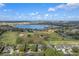 Aerial view of home on golf course community near lake at 3528 Chapel Hill Blvd, Clermont, FL 34711