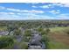 Aerial view of a community with houses, golf course, and lush landscape at 3528 Chapel Hill Blvd, Clermont, FL 34711