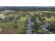 Aerial view of community near golf course and lake at 3528 Chapel Hill Blvd, Clermont, FL 34711