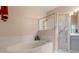 Well-appointed bathroom featuring a tub and a separate shower at 3528 Chapel Hill Blvd, Clermont, FL 34711