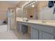 Elegant bathroom with dual vanities, a shower, and a large soaking tub at 3528 Chapel Hill Blvd, Clermont, FL 34711