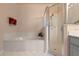 Clean bathroom with a shower, soaking tub and updated gray vanity at 3528 Chapel Hill Blvd, Clermont, FL 34711