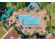 Community pool with plenty of lounge chairs and umbrellas at 3528 Chapel Hill Blvd, Clermont, FL 34711