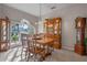 Formal dining room with wooden table, chairs, and a china cabinet at 3528 Chapel Hill Blvd, Clermont, FL 34711