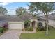 Single-story home with a paved driveway and landscaping at 3528 Chapel Hill Blvd, Clermont, FL 34711