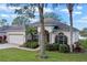 One-story house with a paved driveway and lush landscaping at 3528 Chapel Hill Blvd, Clermont, FL 34711